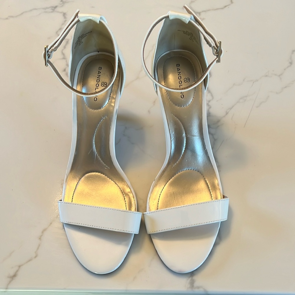 White “Kitten”heels. Never worn! Just too small for me. Adjustable strap.
